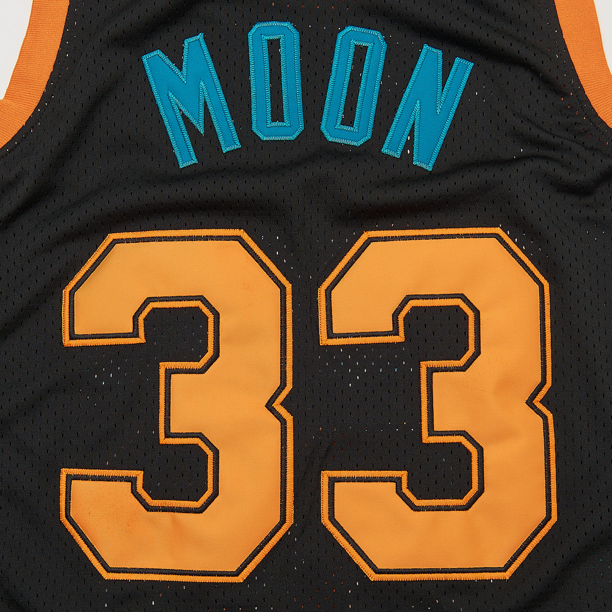 Jackie Moon #33 Semi-Pro Flint Tropics Basketball Jersey — Black — lettering detail