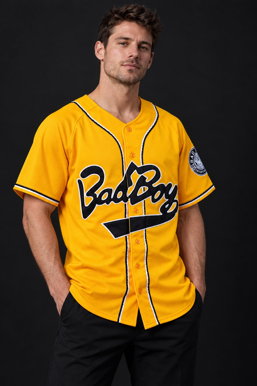 Model wearing the yellow Biggie baseball jersey, front view with embroidered details