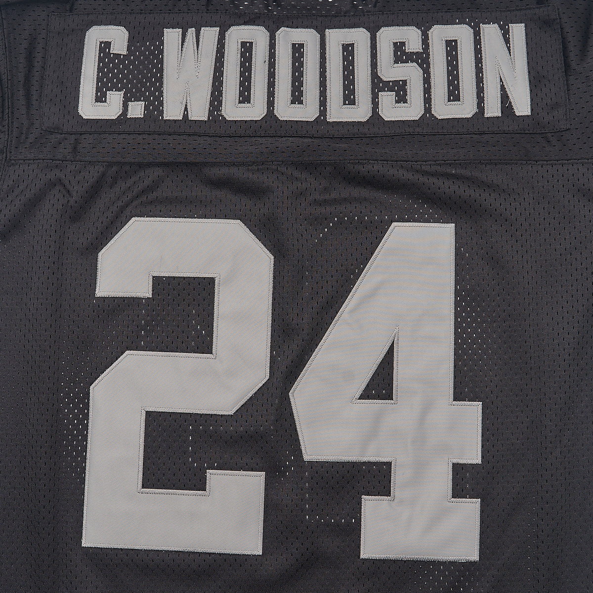 C. Woodson #24 Las Vegas Raiders Football Jersey — Black — lettering detail