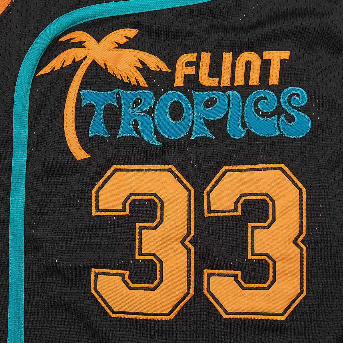 Jackie Moon #33 Semi-Pro Flint Tropics Basketball Jersey — Black — chest detail