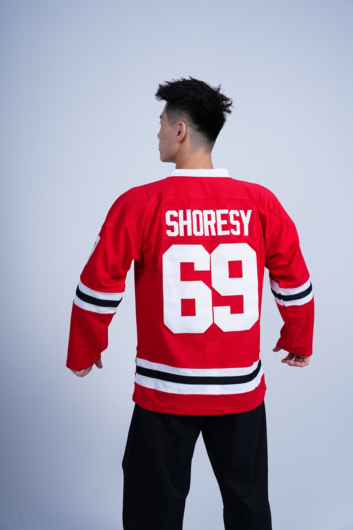 Shoresy Summer Christmas #69 Letterkenny Irish Hockey, red jersey back view worn on a model