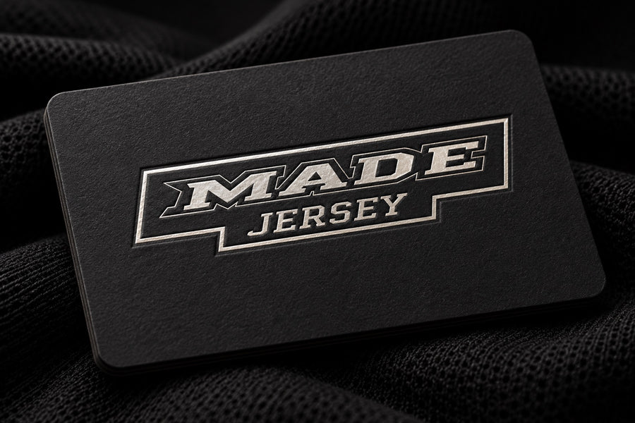 MadeJersey silver foil logo on a textured black brand card